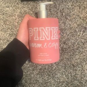 PINK bottle of warm and cozy body lotion